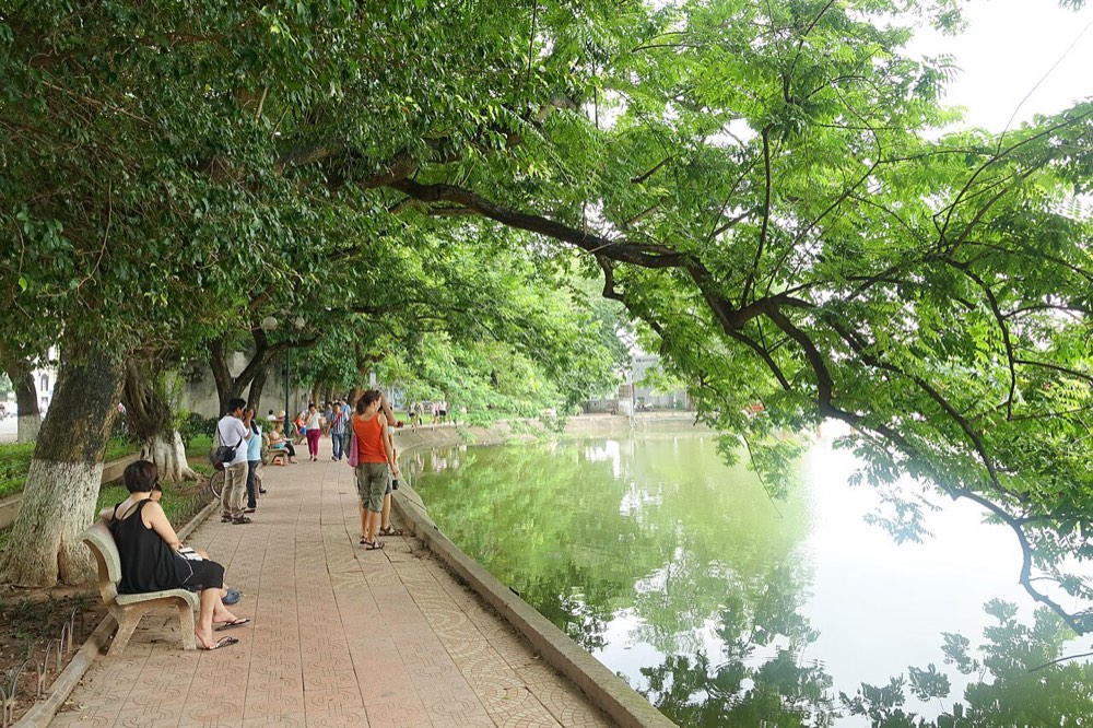 The tree-lined shore of Hoan Kiem Lake in Hanoi